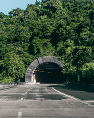 Grey cement underground mountain tunnel highway full of trees from puerto rico in maunabo 
