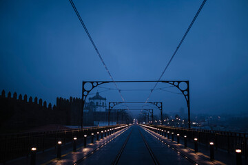 Dom Luis I Iron Bridge in cloudy weather at night, in Porto, Portugal.