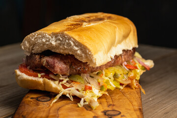 choripan chorizo sandwich on bread with vegetables and chimichurri