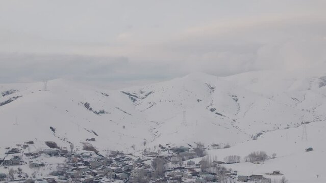 A village in Eastern Turkish mountains under snow in winter.
