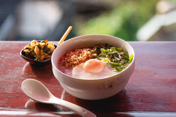 Homemade rice porridge with eggs and minced pork