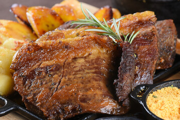barbecue roast beef with rice, boiled cassava salad, farofa and beans, typical Brazilian cuisine