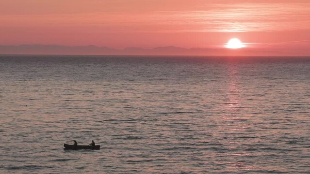 Ocean sunset canoe, calm water, ocean, Vancouver Island. 4K 24FPS