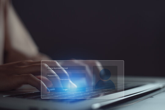Woman hand presses keyboard on laptop to fill in email or phone number and password to access application through virtual screen.
