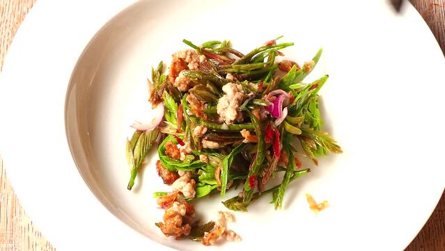 Young tamarind leaves salad , Thai northern famous food.
