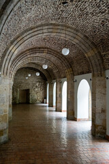 Fototapeta na wymiar corridor with stone arcades natural light from the side, colonial architecture, mexico