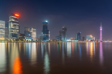 The skyline of urban architecture and the night view of the ancient canal in Guangzhou, China