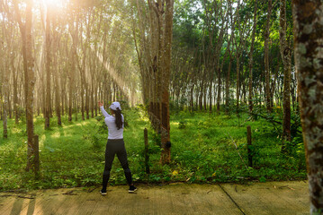 Obraz premium A woman runner streching before start running, morning outdoor activity