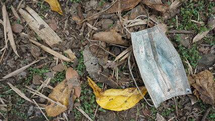 indiscriminate disposal of face masks. Environmental pollution concept