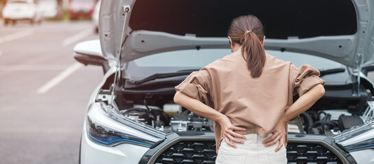 woman driver standing near a problem car. Breakdown or broken car on road. Vehicle Insurance,...