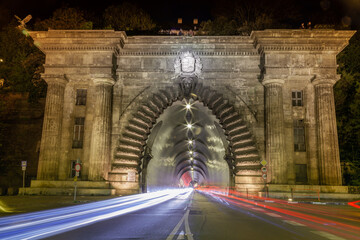 Buda Castle Tunnel at night with car movement trail blurred, Budapest, Hungary