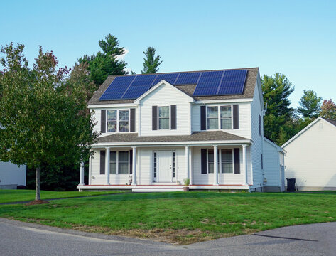 exterior view of house with solar panel installed on the roof