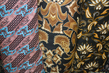 Colorful pile of indonesian batik fabrics or textiles 