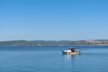 small fishing boat in the sea and fisherman.