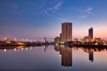 Jeddah, Saudi Arabia, sunset over the corniche and the buildings that are reflected in the sea