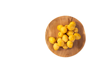 Organic green dates in the wooden bowl - Phoenix dactylifera