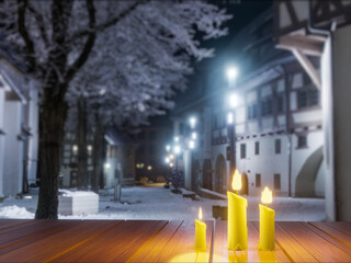 Obraz premium Candles in night in christmas mood on vintage wooden table