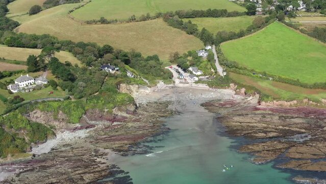 Wide push in establishing view of Talland Bay on the Cornish coast. UK