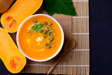 Butternut squash pumpkin soup in bowl, Homemade food in autumn season, Top view