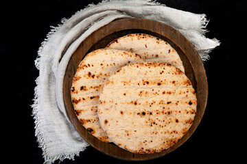 .Pita bread on dark background. Arabic, lebanese bread, traditional food.