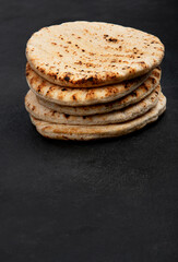 .Pita bread on dark background. Arabic, lebanese bread, traditional food.