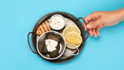 Greek food assortment on color background.