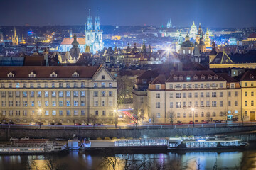 Fototapeta na wymiar Above Prague old town, boats and river Vltava at night, Czech Republic
