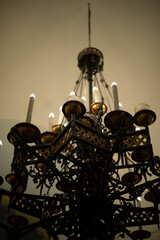 Old chandelier. Interior details. Large chandelier for candles.