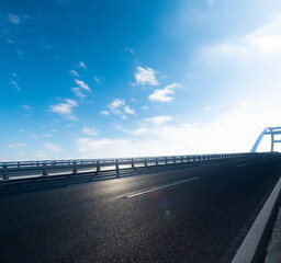 Empty asphalt road highway bridge of city under blue sky