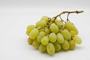 Fresh bunch of white grapes isolated on white background.