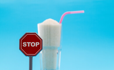 A glass of sugar crystals with stop sign