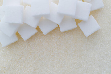 Sugar cubes on top of granulated sugar