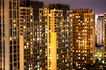 Fototapeta na wymiar City apartment buildings at night
