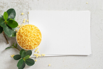 Candelilla wax  in white plate on white paper with copy space background.