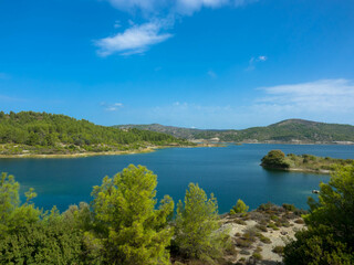 Fototapeta na wymiar Panoramic view of Gadouras Dam. Solving the important and crucial water supply problems. Near the villages of Lardos and Laerma in the southern part of the island. Rhodes, Greece.
