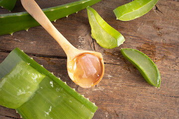 Aloe vera in a spoon on wood. - 540610150