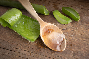 Aloe vera in a spoon on wood. - 540610178