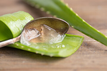 Aloe vera in a spoon on wood. - 540610193