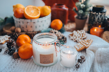 Burning candles on the windowsill in the New Year's decor, atmospheric, aesthetic photography