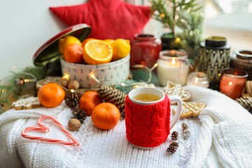 A cup of hot steaming tea in a New Year's atmosphere, aesthetic photo