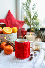 Obraz na płótnie Canvas A cup of hot steaming tea in a New Year's atmosphere, aesthetic photo