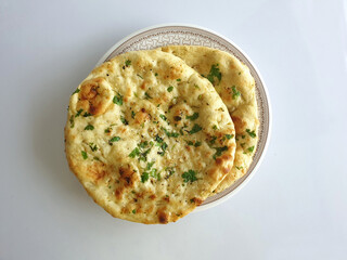 Coriander Naan - Indian flat bread with a sprinkle of fresh coriander leaves and cooked in tandoor