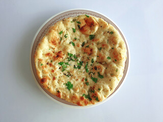 Coriander Naan - Indian flat bread with a sprinkle of fresh coriander leaves and cooked in tandoor