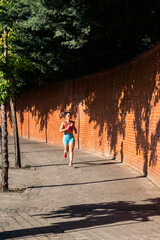 Fit Chinese Woman Running in the City