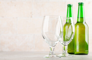Two beer glasses and beer bottles