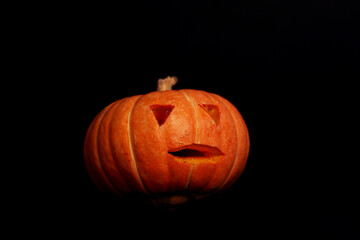 spooky concept - jack-o-lantern isolated on black background. Image contains copy space