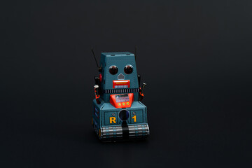Fototapeta premium Retro robot toy on black background