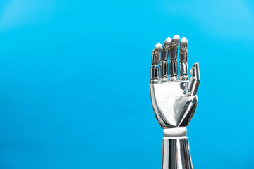 Robot hand on blue background