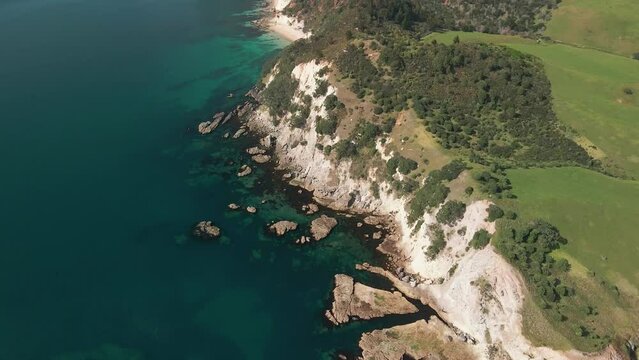 Drone flying over rocky limestone clifftops of Cray fish bay