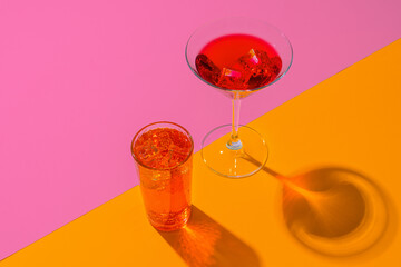 Cold and refreshing cocktails on color background